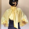 Yellow satin blouse with high neck, bow and puffy sleeves